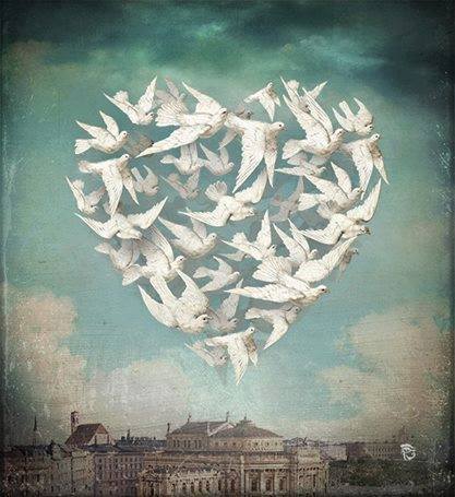 corazón formado por palomas  volando. 